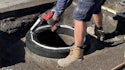 Utility Employs Better Technology to Raise Exposed Manhole to Grade